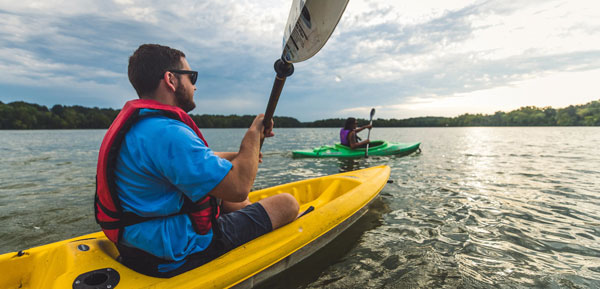 Man riding a kayak on the river