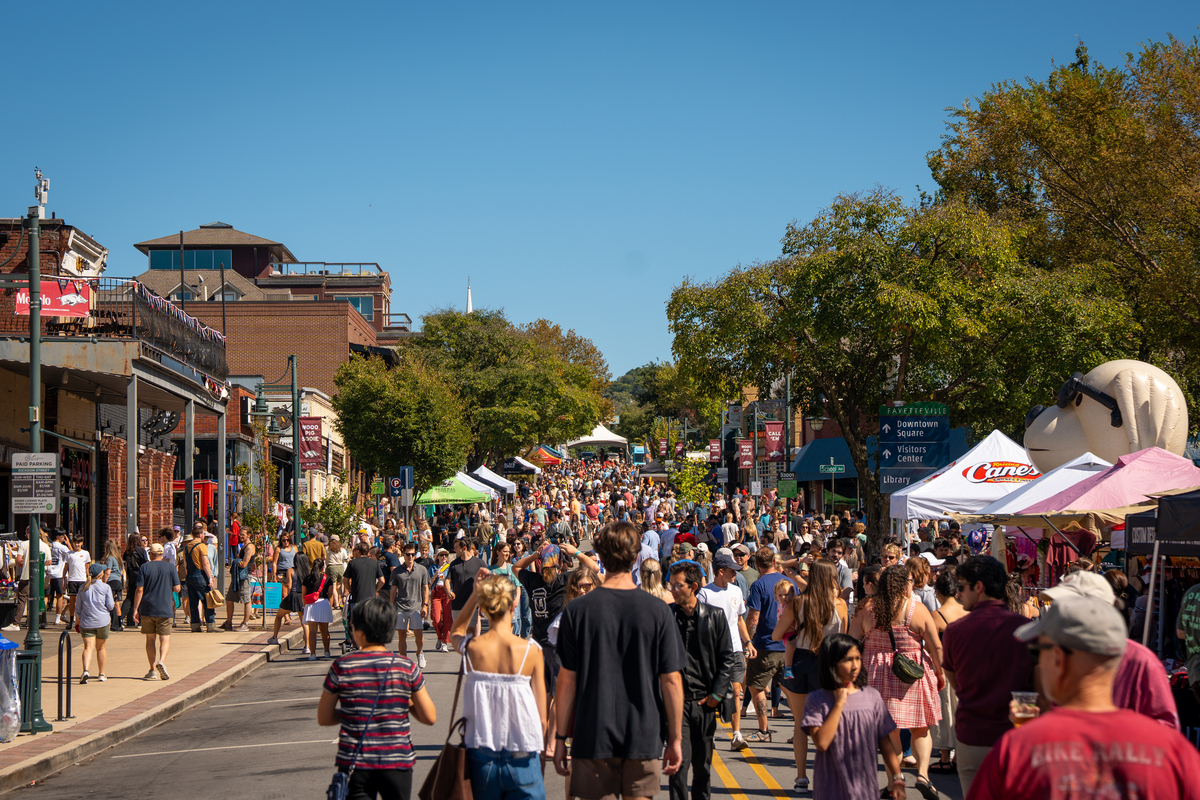 Thousands of people stroll on Dickson Street to celebrate Falltoberfest
