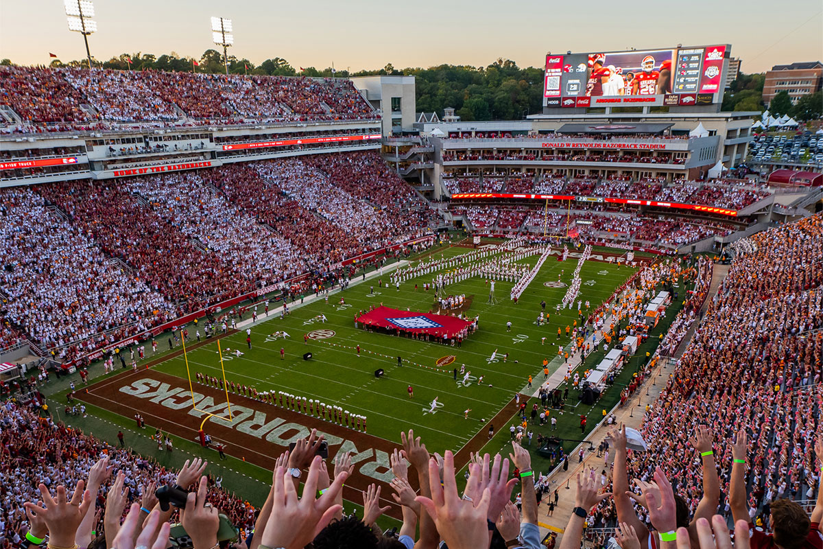crowd calling the hogs at Razorback football game