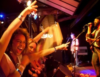 Girls enjoying the concert in front of the stage